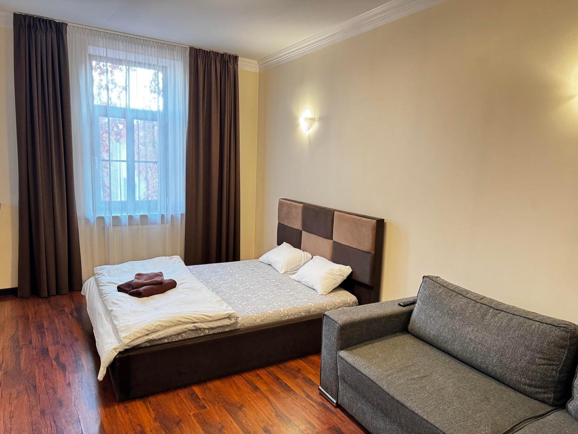 Aparthotel Riga Exterior foto A bedroom in a hotel